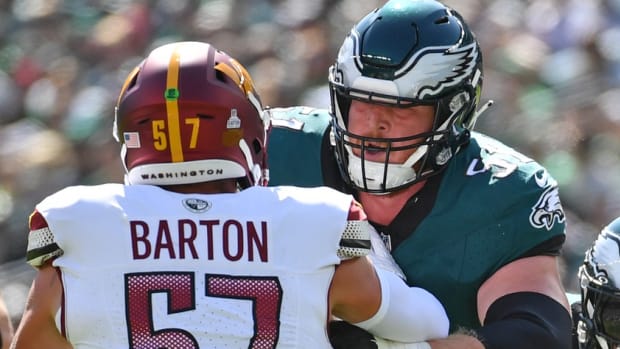 Philadelphia Eagles center Cam Jurgens (51) blocks Washington Commanders linebacker Cody Barton (57) at Lincoln Financial Field.